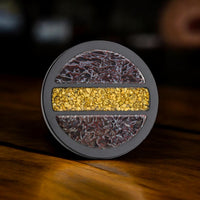 Black Titanium Dinosaur Bone and Gold Nugget Premium Golf Ball Marker by Doubloon Golf