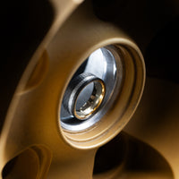 Darkened Tantalum Ring with Supercar Ron Authentic Supercar Wheel Inlay and 10K Gold Sleeve