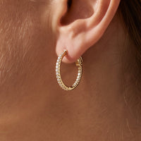 14K Yellow Gold 1/2 CTW Natural Diamond Inside-Outside 19 mm Hinged Hoop Earrings worn by a model