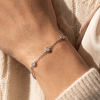 14K White Gold 1/6 CTW Natural Diamond Bezel-Set 3-Station 5 1/2-7" Bracelet worn by a model