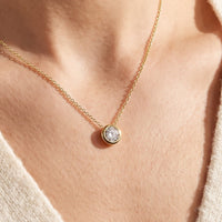 14K Yellow Gold 1/4 CT Natural Diamond Bezel-Set 16-18" Necklace worn by a model