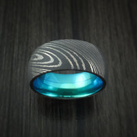 Damascus Steel Ring with Anodized Titanium Interior Sleeve Custom Made