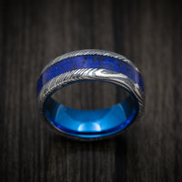 Woodgrain Kuro Damascus Steel with Anodized Sleeve and Custom Dinosaur Bone and Stone Inlay