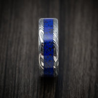 Woodgrain Kuro Damascus Steel with Anodized Sleeve and Custom Dinosaur Bone and Stone Inlay