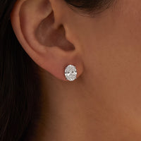 14K White Gold 3 5/8 CTW Lab-Grown Diamond Earrings worn by a model