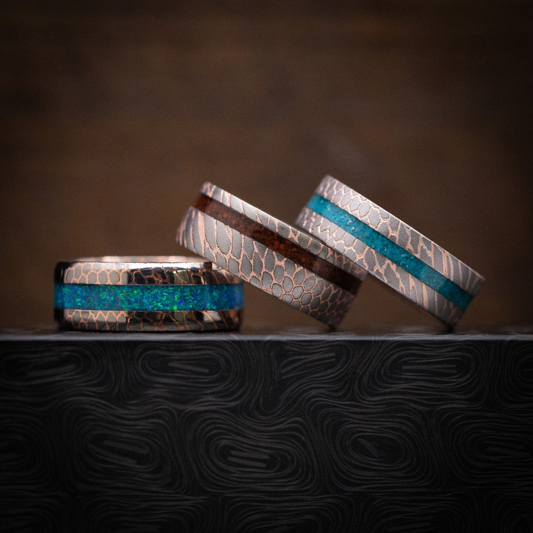 Superconductor Rings with Mosaic Inlays
