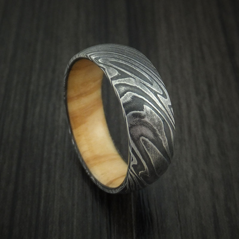 Kuro Damascus Steel Ring with Olive Wood Hardwood Sleeve Custom Made Wood Band