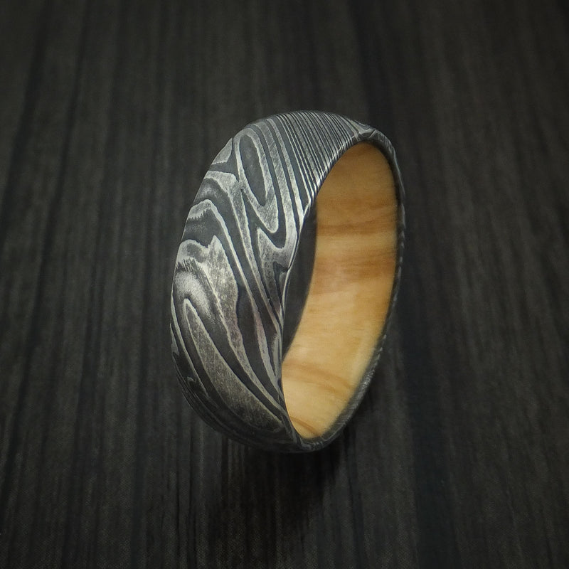 Kuro Damascus Steel Ring with Olive Wood Hardwood Sleeve Custom Made Wood Band