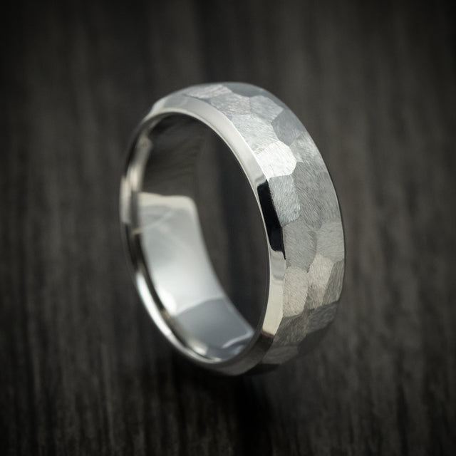 Titanium men’s wedding ring with a rock finish on a domed beveled band